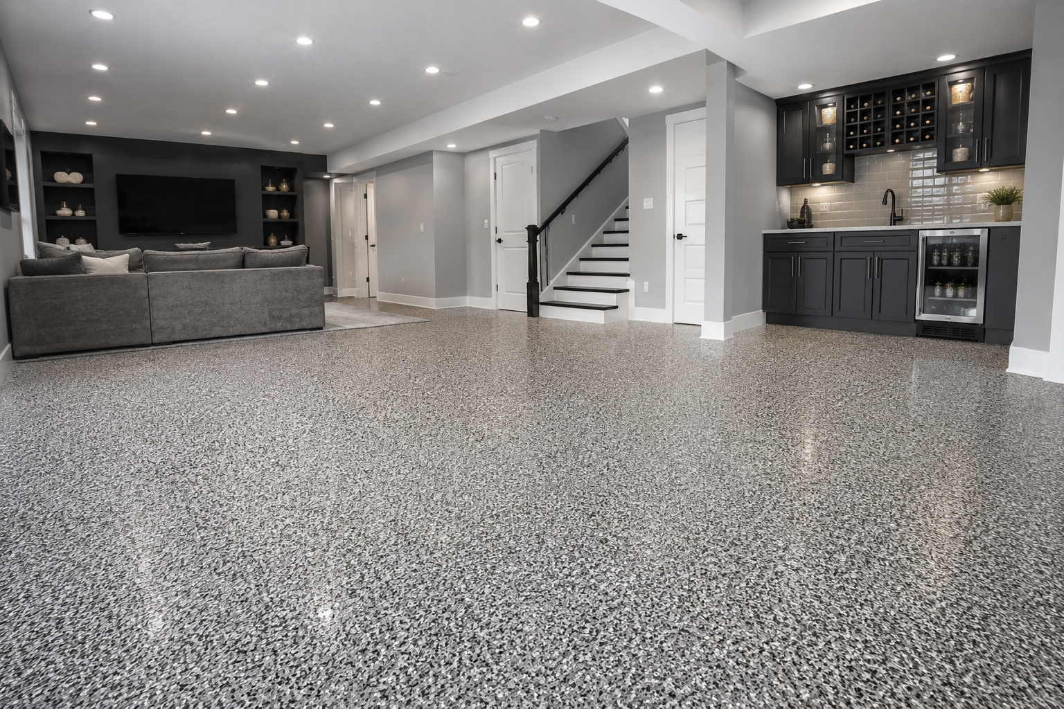Services beautiful flake epoxy flooring in a staged basement